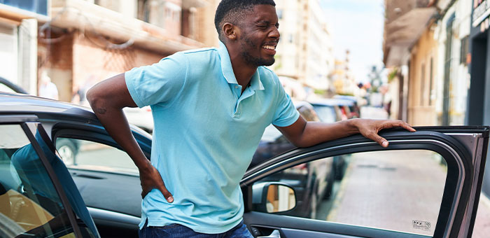 patient with hip pain needing auto accident chiropractor in Richardson