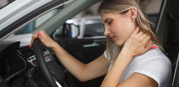 patient with neck pain needing auto accident chiropractor in Richardson