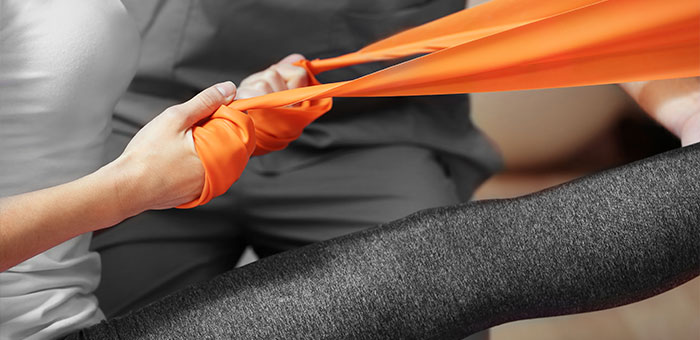 patient receiving therapeutic exercise for auto accident injury treatment in Richardson